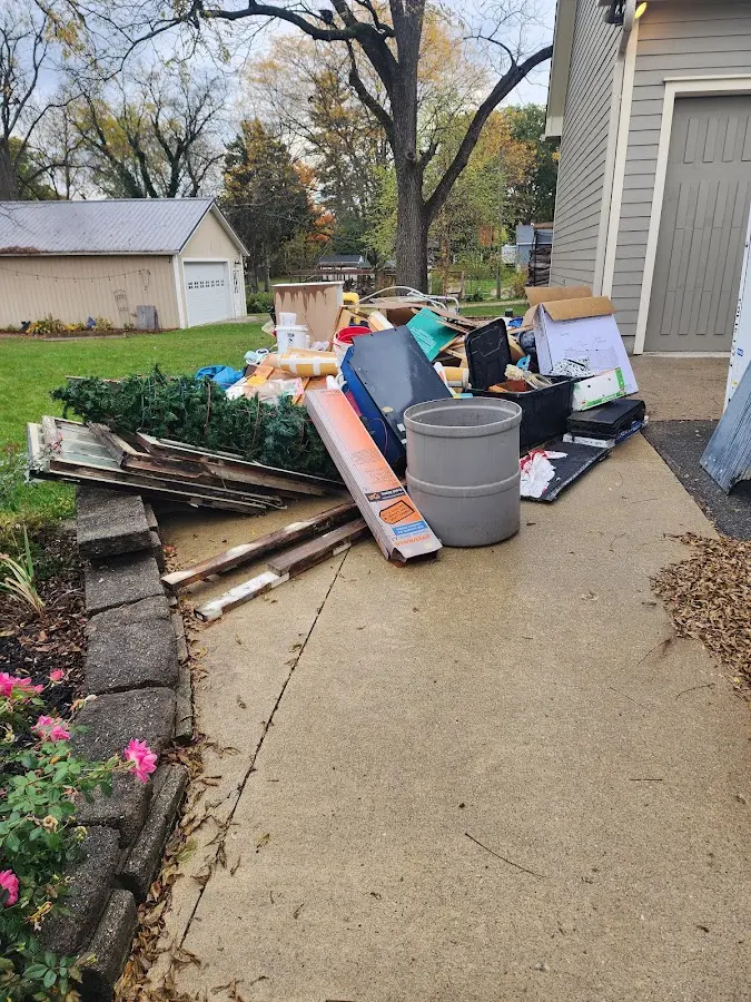 Dumpster being loaded with debris for Demolition Dumpster Rental in Jeffersonville